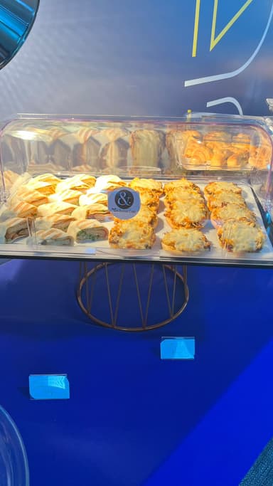 Assorted savoury pastries on a covered catering tray