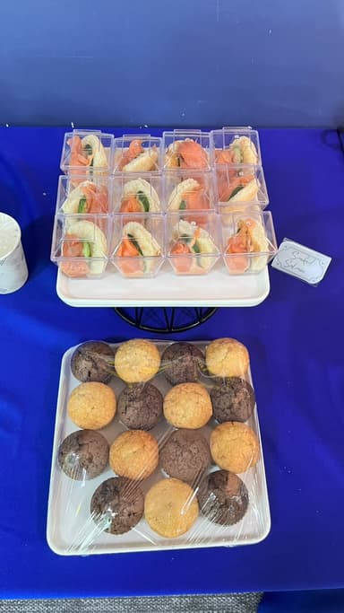 Boxed sandwiches and chocolate and vanilla muffins